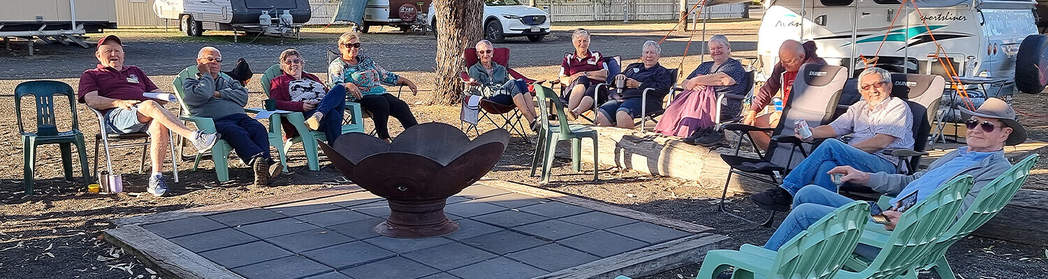 Group of strangers enjoying an evening by the fire