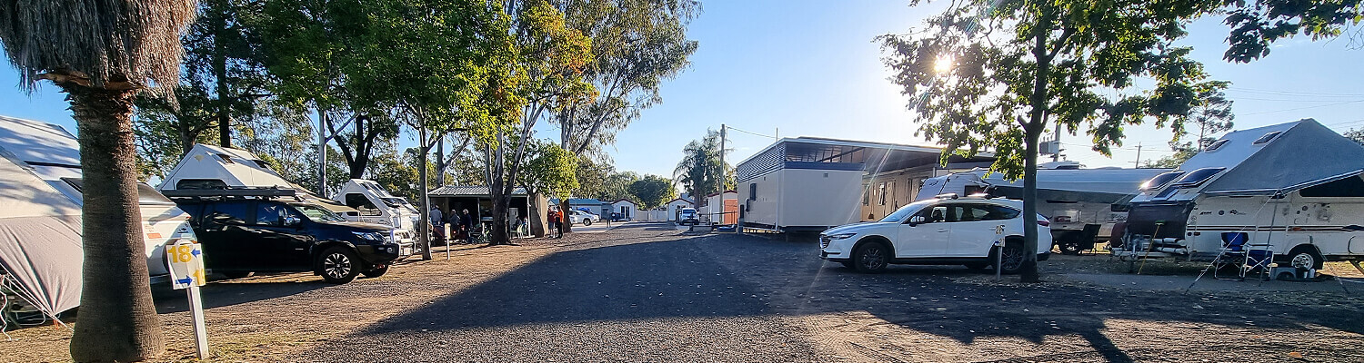 Sun sets over rows of caravans and camper homes